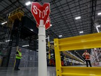 Security personel keep track of the various lanes created for lifts and workers, at the newly opened Amazon Fulfillment Center in Fall River.    With over 1 million square feet of space, this fulfillment center is the largest in the country.   [ PETER PEREIRA/THE STANDARD-TIMES/SCMG ]