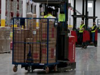 Lift drivers head between rows to pick up sold items, at the newly opened Amazon Fulfillment Center in Fall River.   With over 1 million square feet of space, this fulfillment center is the largest in the country.    [ PETER PEREIRA/THE STANDARD-TIMES/SCMG ]