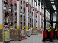 Lift drivers head between rows to pick up sold items, at the newly opened Amazon Fulfillment Center in Fall River.  With over 1 million square feet of space, this fulfillment center is the largest in the country.    [ PETER PEREIRA/THE STANDARD-TIMES/SCMG ]
