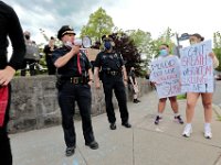 New Bedford police chief Joseph Cordeiro speaks with protestors who gathered at the intersection of Union Street and County Street in downtown New Bedford.  The protestors then marched to the site where Malcom Gracia was killed by police on Cedar Street in 2012.  PHOTO PETER PEREIRA