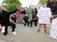 New Bedford police chief Joseph Cordeiro joins protestors in taking a knee in memory of George Floyd.  The protest started at the intersection of Union Street and County Street in downtown New Bedford and progressed to the site where Malcom Gracia was killed by police on Cedar Street in 2012.  PHOTO PETER PEREIRA