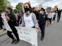 New Bedford police chief Joseph Cordeiro joins protestors as they march from the intersection of Union Street and County Street in downtown New Bedford to the site where Malcom Gracia was killed by police on Cedar Street in 2012.  PHOTO PETER PEREIRA