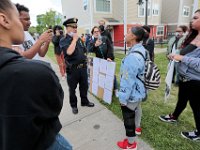 New Bedford police chief Joseph Cordeiro listens to concerns by protestors who feel they are not being well treated by police. The protest started at the intersection of Union Street and County Street in downtown New Bedford and then progressed to the site where Malcom Gracia was killed by police on Cedar Street in 2012.  PHOTO PETER PEREIRA