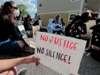 Protestors observe a moment of silence at the site where Malcom Gracia was killed by police on Cedar Street in 2012.  PHOTO PETER PEREIRA