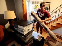 Victor Gonsalves packs what he is bringing, as he prepares to leave from his home on Harvard Street in New Bedford  for his first year at Harvard University.  PHOTO PETER PEREIRA