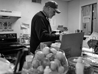 Robert Hughes, program director, unpacks meals from Coastline to be given to residents at the House of Hope homeless shelter on Mount Pleasant Street in New Bedford.