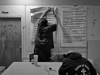 Mario Vardaro puts up some tenets for residents to live by at the House of Hope homeless shelter on Mount Pleasant Street in New Bedford.