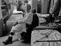 Liam McBrien, who lost his left leg to diabetes, takes a bag of his clothes that need to be washed to the laundry area at the House of Hope homeless shelter on Mount Pleasant Street in New Bedford. Most shelters will not admit handicap residents.