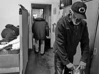 Robert Tratzinski gives a hand in washing the carpet with a machine at the House of Hope homeless shelter on Mount Pleasant Street in New Bedford.