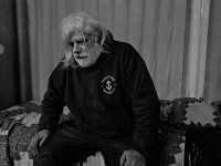 J.P. Fountaine, a recovering heroin addict, sits on his bed at the House of Hope homeless shelter on Mount Pleasant Street in New Bedford.