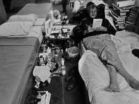 Mario Tome works on solving a Soduko puzzle while lying down on his bed at the House of Hope homeless shelter on Mount Pleasant Street in New Bedford.