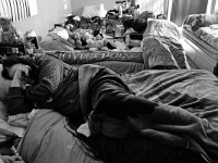 A woman resident of the House of Hope homeless shelter on Mount Pleasant Street in New Bedford takes an afternoon nap.