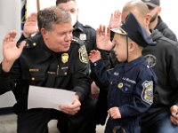 JJ Montalban, 6, who was born with congenial heart defects, is sworn in as an honorary New Bedford police officer by police chief, Paul Oliveira at a ceremony held at police headquarters on Rockdale Avenue in New Bedford.  JJ Montalban is currently in need of a heart transplant. PHOTO PETER PEREIRA