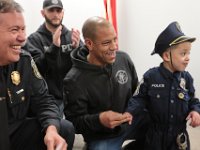 New Bedford police chief, Paul Oliveira, and officer Shane Harris congratulate JJ Montalban, 6, after he was sworn in as an honorary New Bedford police officer at a ceremony held at police headquarters on Rockdale Avenue in New Bedford.   JJ Montalban, who was born with various congenial heart defects, is currently in need of a heart transplant. PHOTO PETER PEREIRA