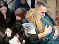 Richard Marques, father of Mark Cormier Jr, and Jeannine Cronin, Mark's fiancee, seek comfort in each other during the service in celebration of Mark's life held at the Seamen's Bethel in New Bedford.  Mark Cormier Jr., 35, along with two other fishermen were lost at sea aboard the New Bedford fishing vessel Leonardo on November 24, 2019.    PHOTO PETER PEREIRA