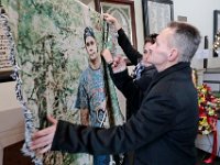 Richard Marques and Annette Blankenship remove a tapestry of their son Mark Cormier Jr. during a service in celebration his life of held at the Seamen's Bethel in New Bedford.  Mark Cormier Jr., 35, along with two other fishermen were lost at sea aboard the New Bedford fishing vessel Leonardo on November 24, 2019.  PHOTO PETER PEREIRA