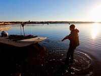 Matt Loo pulls his boat out of the water after heading out to his 1acre oyster farm at Jack's Cove off of West Island in Fairhaven, MA.