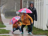 (l to r) Blaire Ferreira and her sister Sophie Ferreira do a little dancing, as they go for a rain walk with their great aunt Bokkie Philla in Fairhaven. PHOTO PETER PEREIRA