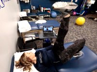 Physical therapist, Marissa Gill, performs virtual leg exercises with her patient using Telehealth software on her laptop at Bay State Physical Therapy in Dartmouth.  PHOTO PETER PEREIRA