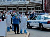 Nurses and hospital staff come out to see NBPD and NBFD drive past the entrance to the emergency room at St. Luke's Hospital in New Bedford as a show of support for healthcare workers.  PHOTO PETER PEREIRA