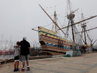 Chad Reynolds and his son Kaleb Reynolds, 9, enjoy the view of the Mayflower II at State Pier in New Bedford. The Mayflower II made an unscheduled overnight stop at State Pier in New Bedford to ride out Tropical Storm Isaias.  PHOTO PETER PEREIRA