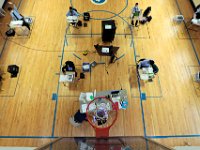 Fifth grade social studies teacher, Anna DeLong, is seen directly below the basketball hoop as she teachers her class inside the gym of the Nativity Preparatory School on Spring Street in New Bedford.  PHOTO PETER PEREIRA