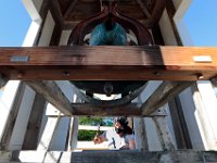 The bell of the Bell School House looms above, as Amanda Gray of Heritage Restoration works on restoring the steeple of the school built in 1841 on Drift Road in Westport. The Bell School House currently houses the Westport Historical Society.  PHOTO PETER PEREIRA