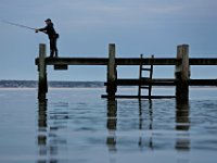 A man casts his line from a pier in the south end of New Bedford, MA on a perfect morning. May 13, 2020. PHOTO PETER PEREIRA