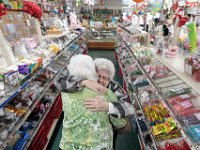Long time customer, Cora Baker, gives owner Jaqueline Bowden a heartfelt hug after finding out that Billy Boy Candy in New Bedford will be closing in April after 60 years of operation. PHOTO PETER PEREIRA