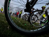 With colorful lights inside their wheels, Youth Opportunities Unlimited attendees prepare to go for a sunset bike ride with Starchasers around Fort Taber Park in the south end of New Bedford. PHOTO PETER PEREIRA