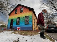 Eli Rickson, 7, plays in front of his  house in Mattapiosett which he had his father paint in rainbow colors. PHOTO PETER PEREIRA