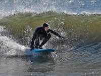 A surfer takes advantage of the swell brought in by yesterdays storm conditions, to surf at Horseneck Beach in Westport.  PHOTO PETER PEREIRA
