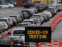Hundreds of motorists line up at the Whale's Tooth parking lot in New Bedford to be tested for COVID-19.  PHOTO PETER PEREIRA