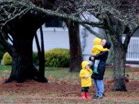 A woman and two small children enjoy each others company during a walk around Buttonwood Park in New Bedford on a rainy day.  PHOTO PETER PEREIRA