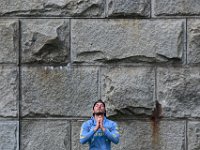 Nathan Vaughn enjoys a session of yoga in front of the colossal stone walls of Fort Rodman at Fort Taber Park in the south end of New Bedford.  PHOTO PETER PEREIRA