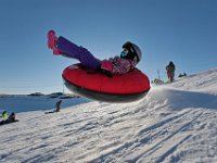Avery Correia, 6, flies through the air during a session of sledding at Potato Hill in Westport.