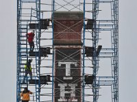 Three men find themselves high above New Bedford as they inspect the chimney of The Car Barn apartment complex, currently undergoing repairs.