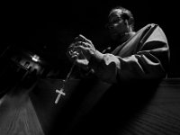 Rob Grant takes a moment to pray the rosary at Our Lady's Chapel in downtown New Bedford on Holy Thursday leading up to Easter Sunday.