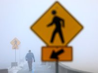 Jerry Laperriere emerges from the fog as he goes for a walk around the south end of New Bedford.