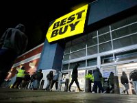 Shoppers walk into Best Buy in Dartmouth after doors opened at 5am on Black Friday.