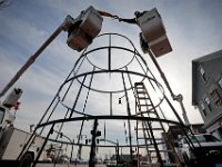 New Bedford DPI workmen install the framework for a thirty five foot tall Christmas tree they are installing at the intersection of Route 18 and Union Street in downtown New Bedford.