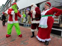 The Grinch (Brandon Webb) and Santa Clause and Mrs. Clause (who happen to be driving by and spotted their foe) put up their dukes in front of Cojo's Toy World on Purchase Street in New Bedford.