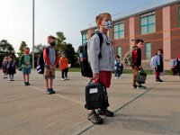 Students are socially distanced, as they wait to make their way into the Leroy Wood School in Fairhaven for the first day of school.  This is the first time that students have been allowed back to the school since March.  PHOTO PETER PEREIRA