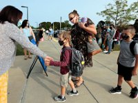 Parents drop off their children, as teachers offer guidance for students arriving for the first day of school at the Leroy Wood School in Fairhaven.  This is the first time that students have been allowed back to the school since March.  PHOTO PETER PEREIRA