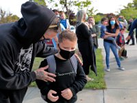 A parent offers his son a good day as students arrive for the first day of school at the Leroy Wood School in Fairhaven.  This is the first time that students have been allowed back to the school since March.  PHOTO PETER PEREIRA