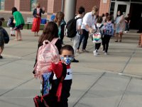 A student says goodbye as he and fellow  students make their way into the Wood School in Fairhaven for the first day of school. This is the first time that students have been allowed back to the school since March.  PHOTO PETER PEREIRA