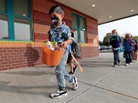 A student makes his way into the Leroy Wood School in Fairhaven for the first day of school.  This is the first time that students have been allowed back to the school since March.  PHOTO PETER PEREIRA