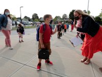 Teachers and studets greet each other for the first time since March as students arrive for the first day of school at the Leroy Wood School in Fairhaven.  PHOTO PETER PEREIRA