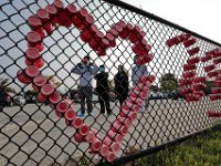 Parents are unable to walk past the fence in front of the school, as they look on while students make their way for the first day of school at the Leroy Wood School in Fairhaven.  This is the first time that students have been allowed back to the school since March.  PHOTO PETER PEREIRA