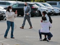 Parents take photos of their children before they make their way into the Leroy Wood School in Fairhaven for their first day of school.  This is the first time that students have been allowed back to the school since March.  PHOTO PETER PEREIRA